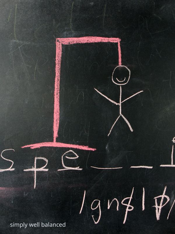 Hangman game on chalkboard.