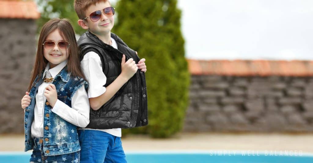 Siblings doing a back to school fashion show with their new clothes. 