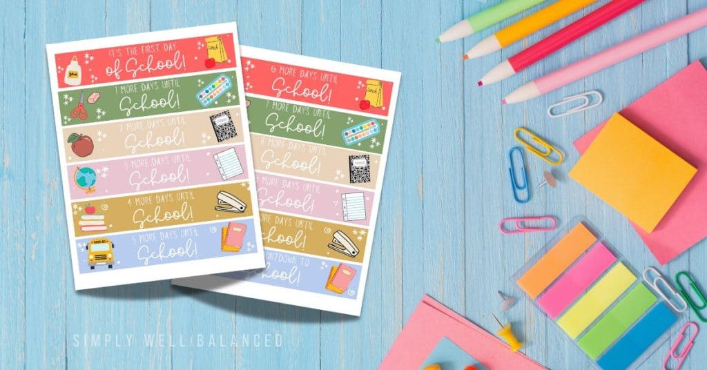 Free printable back to school paper chain countdown on a table with school supplies. 