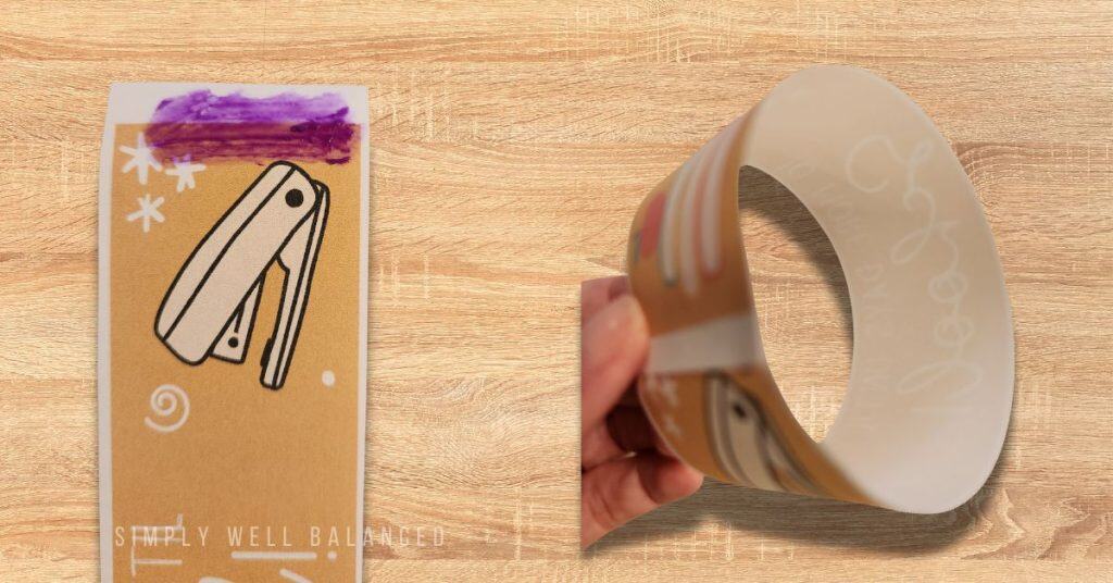 Close up image showing where to apply glue to create the rings for your paper chain. 