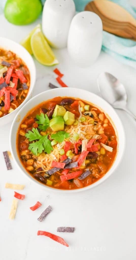 Lazy Mom Taco Soup Recipe in a bowl with toppings.